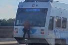 Viral video shows man riding on the back of VTA train in San Jose